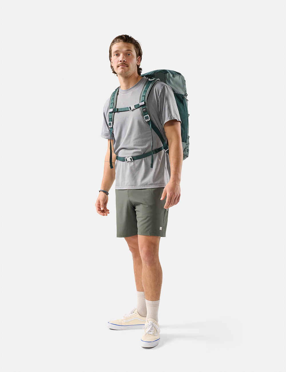 video of man wearing juniper backpack on white background