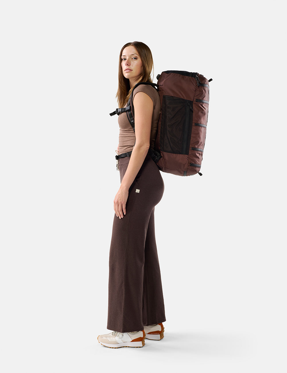 video of woman wearing garnet backpack