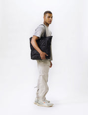 video of man wearing black tote pack
