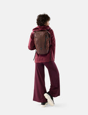 video of woman wearing garnet backpack