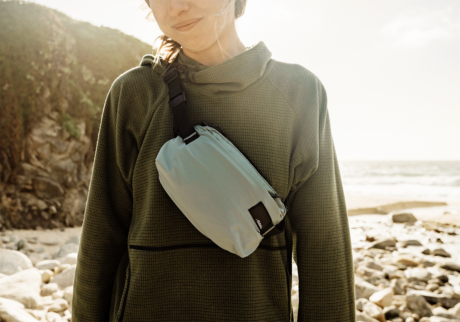 a person wearing packable cross-body sling with water resistance