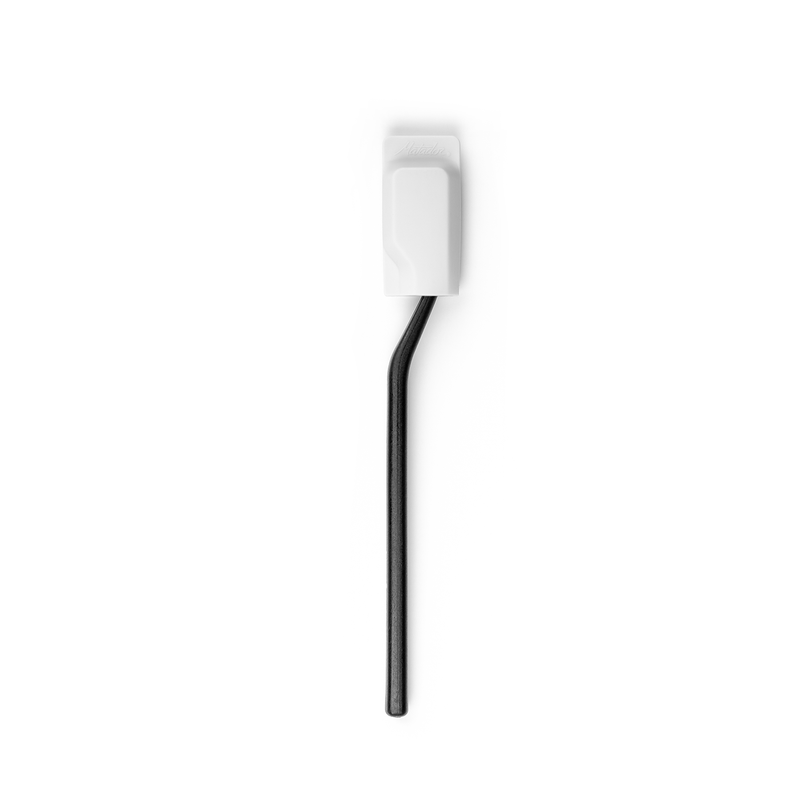 Black toothbrush in white cap on white background