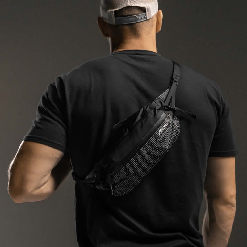 Man wearing hip pack across his back