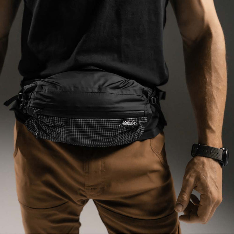 Man wearing hip pack at waist