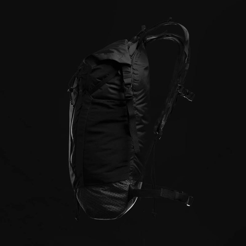 Side view of backpack on black background