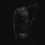 Side view of backpack on black background
