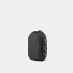 3/4 view of Black Granite NanoDry Trek Towel in silicone case on white background