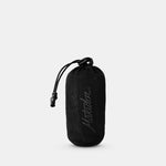 Packed down trek towel pouch on white background