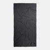 Charcoal beach towel laid flat on white background