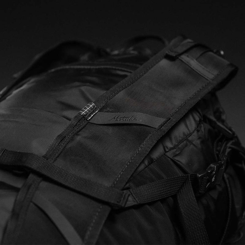 Detail view of Matador logo on backpack strap