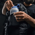 Man placing Nalgene water bottle in water bottle pocket