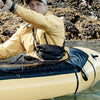 Man in sea kayak wearing cross body hip pack