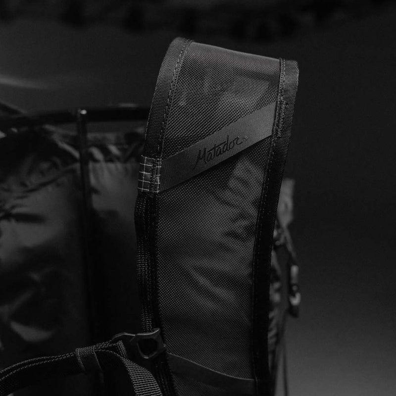 Close up view of Matador logo on backpack strap