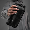 Man holding 2 liter dry bag in his hand