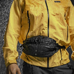 Man wearing hip pack in rain