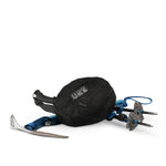 Beast28 packed up in mesh bag laying with trekking poles and ice axe on white background