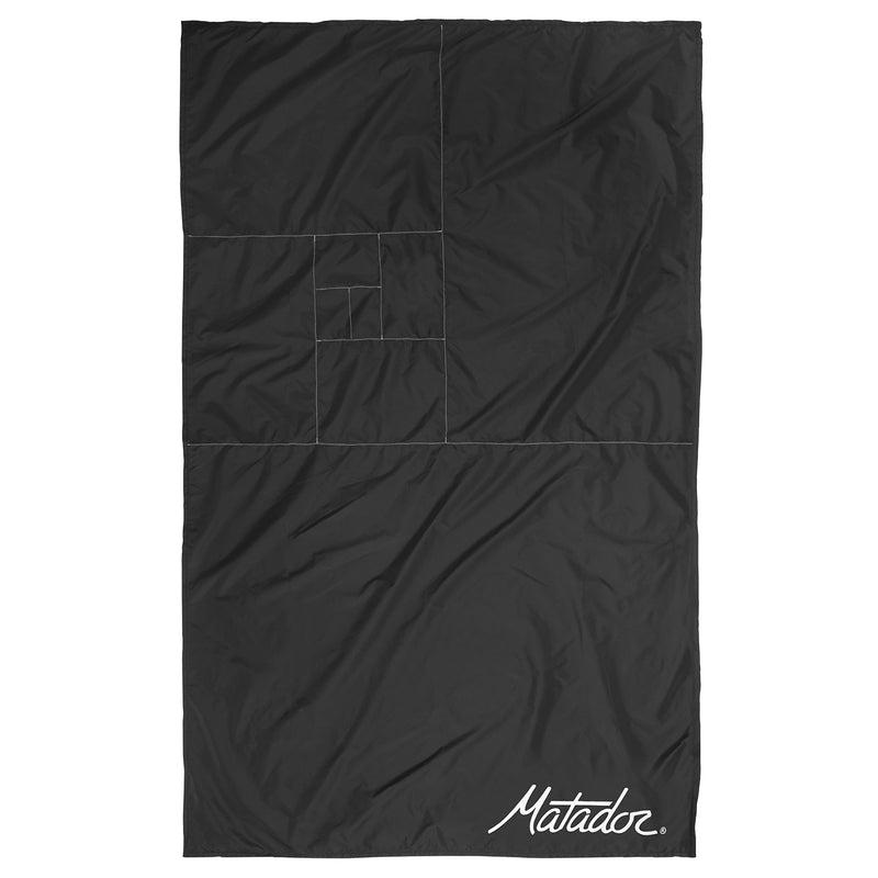Flat lay of pocket blanket with fold stitching on white background