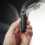 Hand holding black earplug case